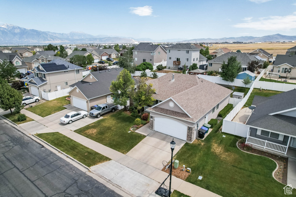Aerial perspective of suburban area with a mountain backdrop