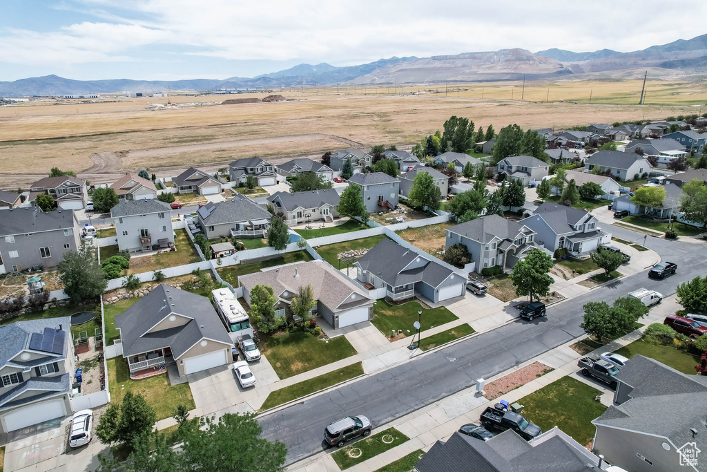 Aerial perspective of suburban area with a mountain backdrop