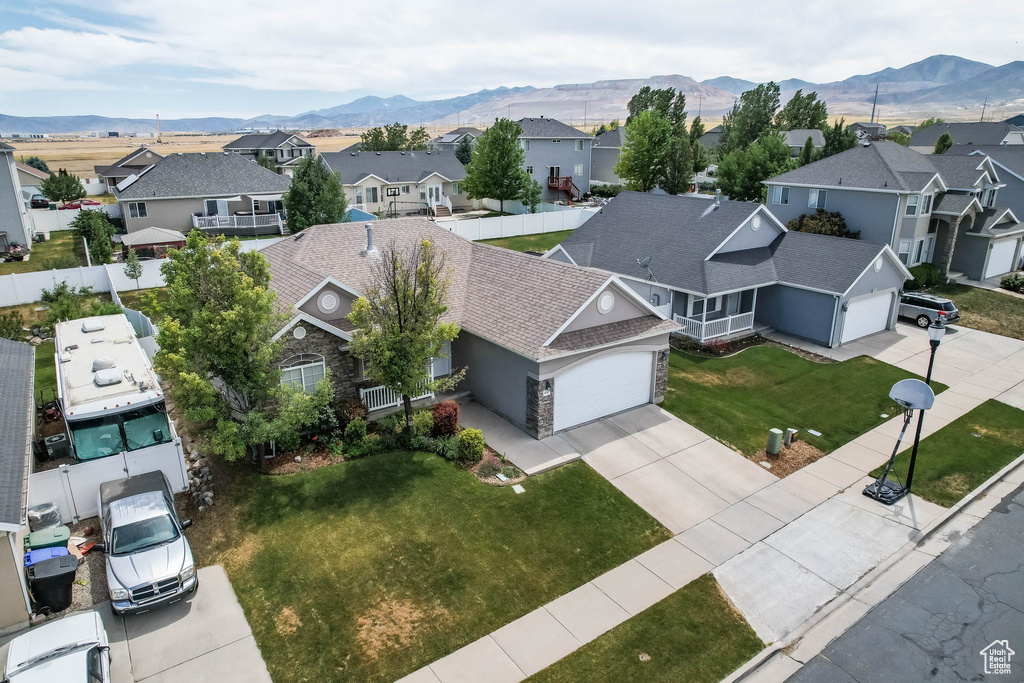 Aerial perspective of suburban area with a mountain backdrop