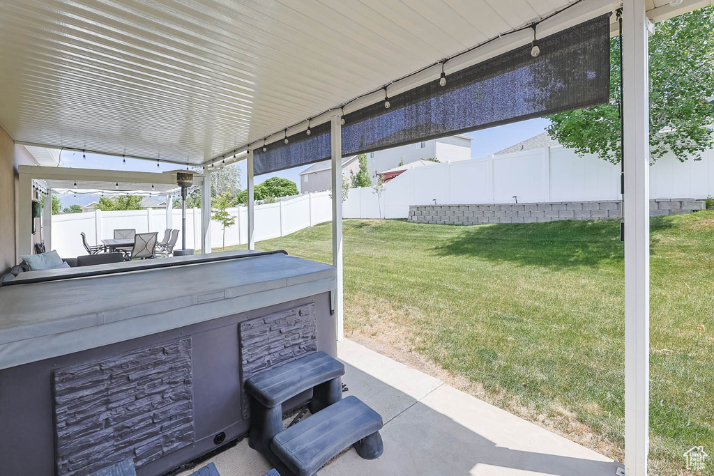 Fenced backyard with a patio