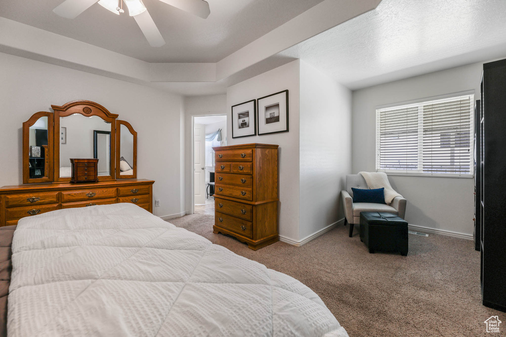 Bedroom with carpet and a ceiling fan