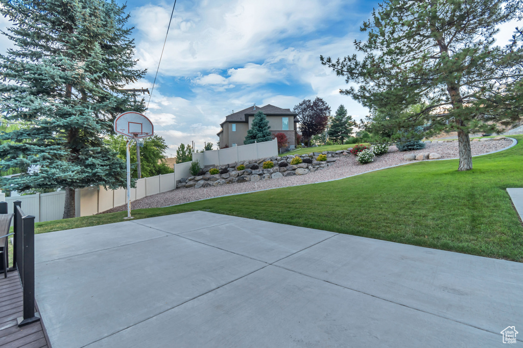 View of yard with community basketball court