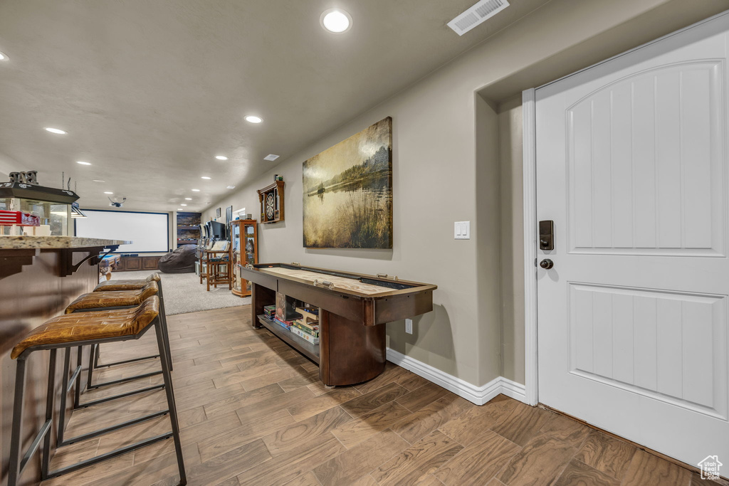 Entrance foyer featuring recessed lighting and wood finished floors