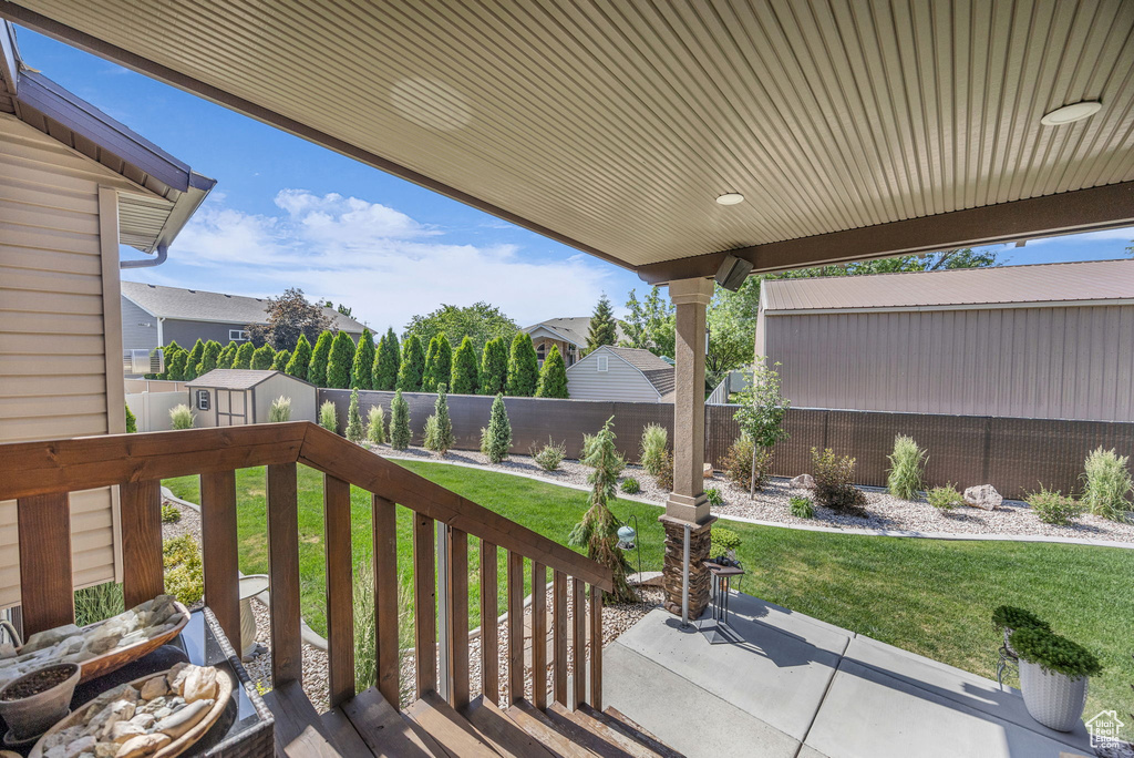 Wooden deck featuring a fenced backyard
