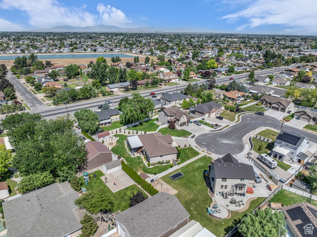 Aerial view of residential area featuring a large body of water