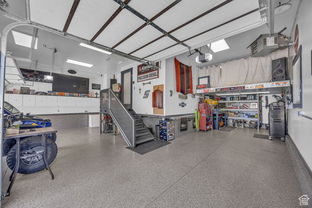 Garage featuring a garage door opener