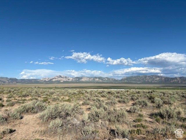 View of mountain backdrop with rural landscape