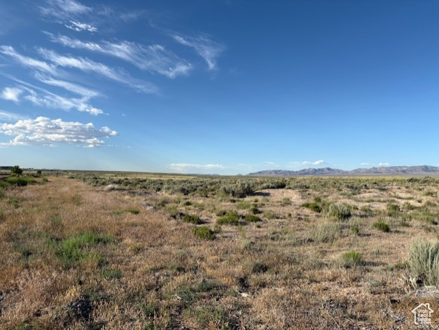 View of undeveloped land with rural landscape and mountains