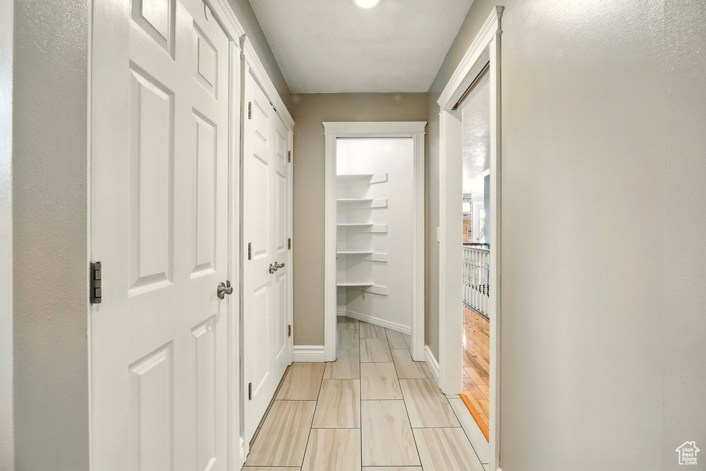 Corridor featuring baseboards