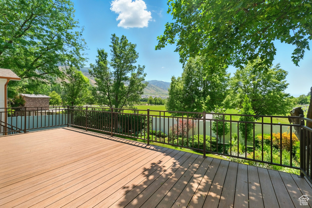 Wooden deck featuring a mountain view