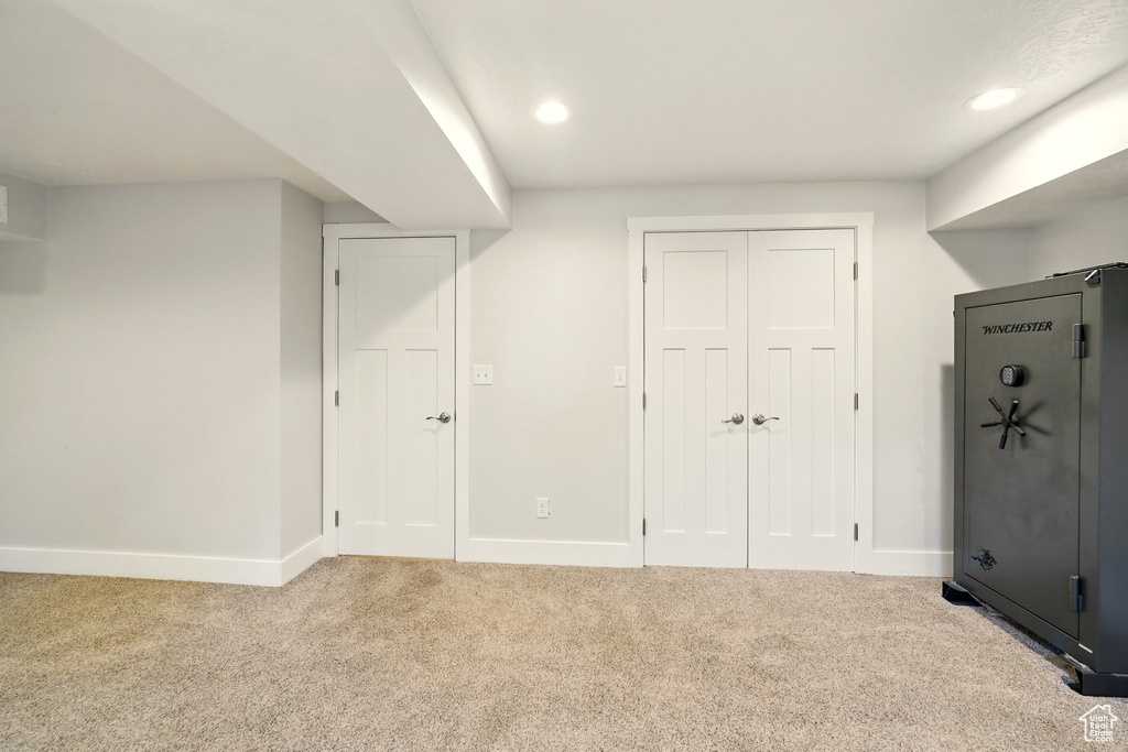 Unfurnished bedroom featuring carpet, a closet, and recessed lighting
