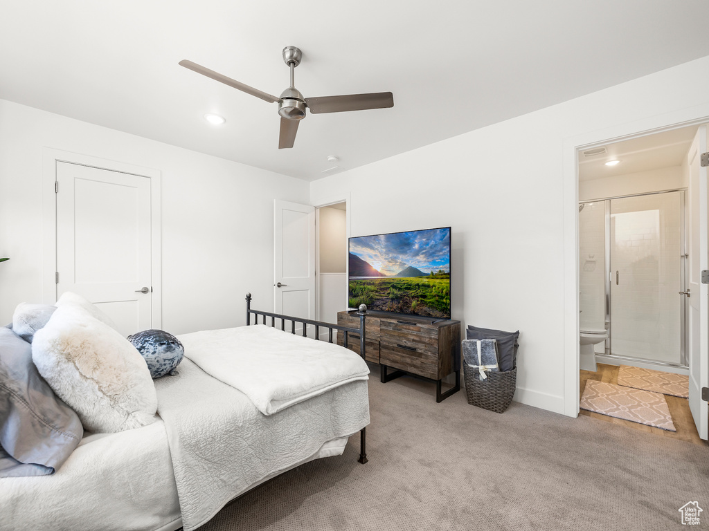 Bedroom featuring carpet floors, recessed lighting, ceiling fan, and ensuite bathroom
