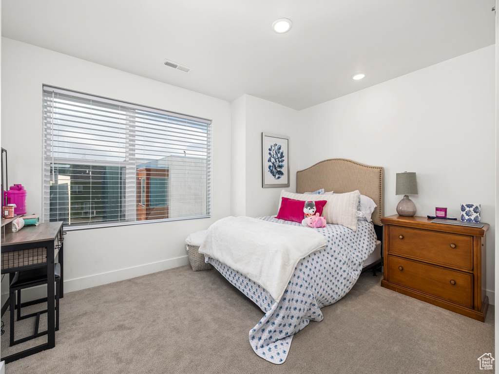 Carpeted bedroom featuring baseboards and recessed lighting