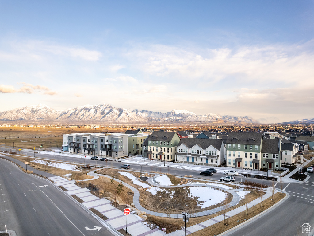 Aerial view of residential area featuring a mountain backdrop