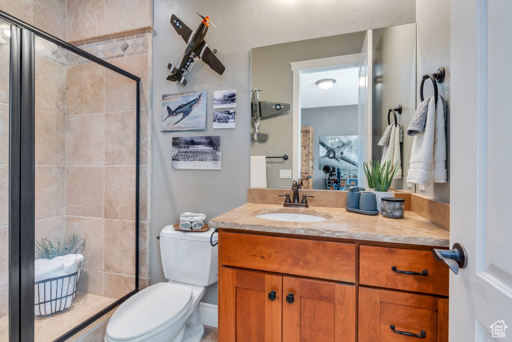 Full bathroom with vanity and a stall shower