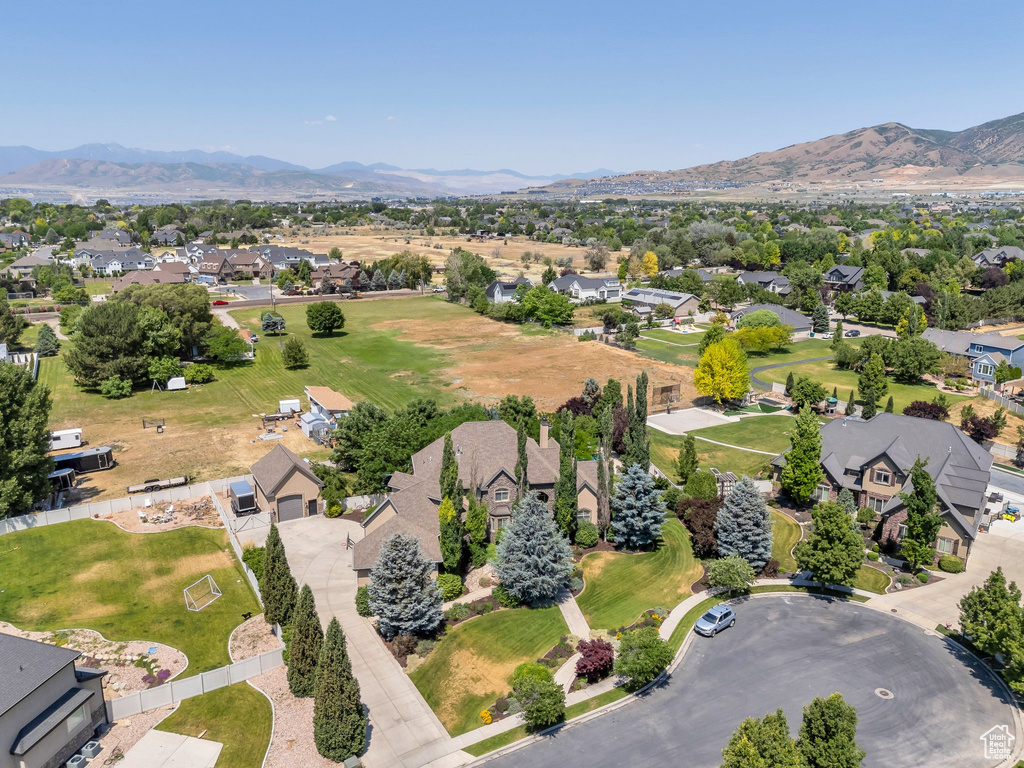Aerial perspective of suburban area with a mountainous background
