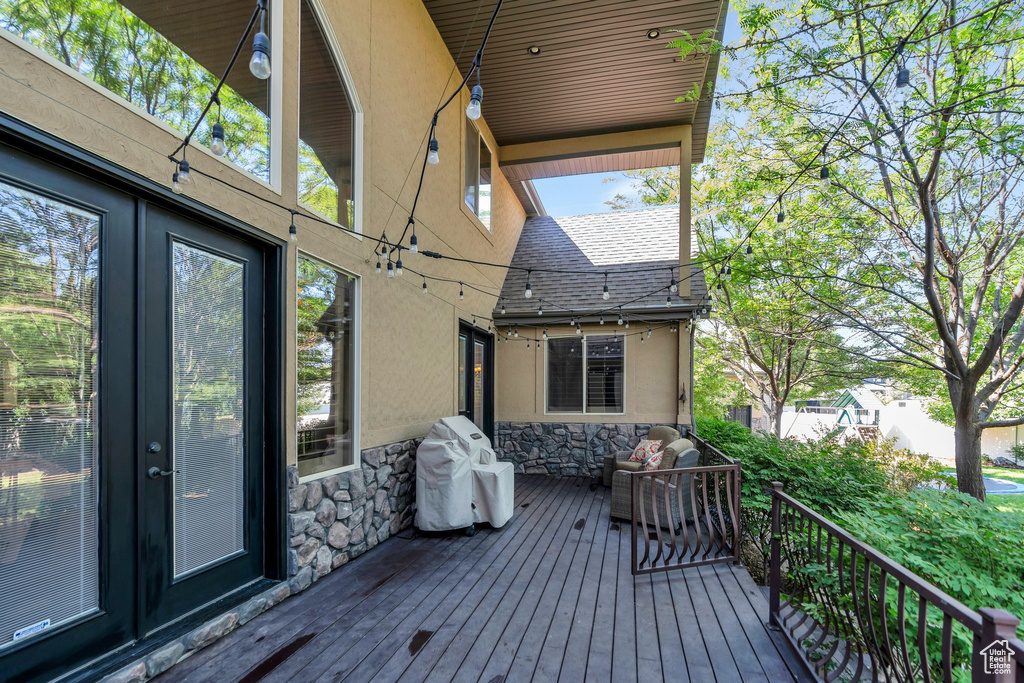 Wooden terrace with grilling area and french doors