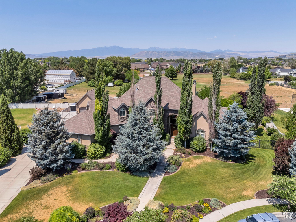 Aerial perspective of suburban area featuring a mountain backdrop