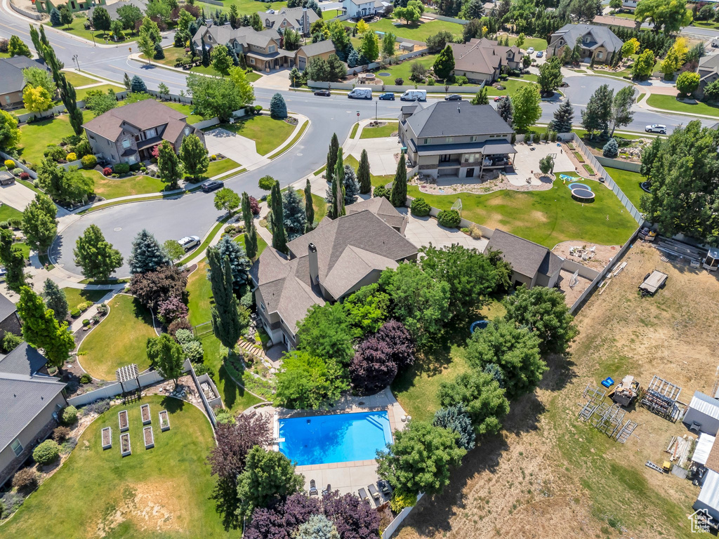 Aerial perspective of suburban area with a pool area