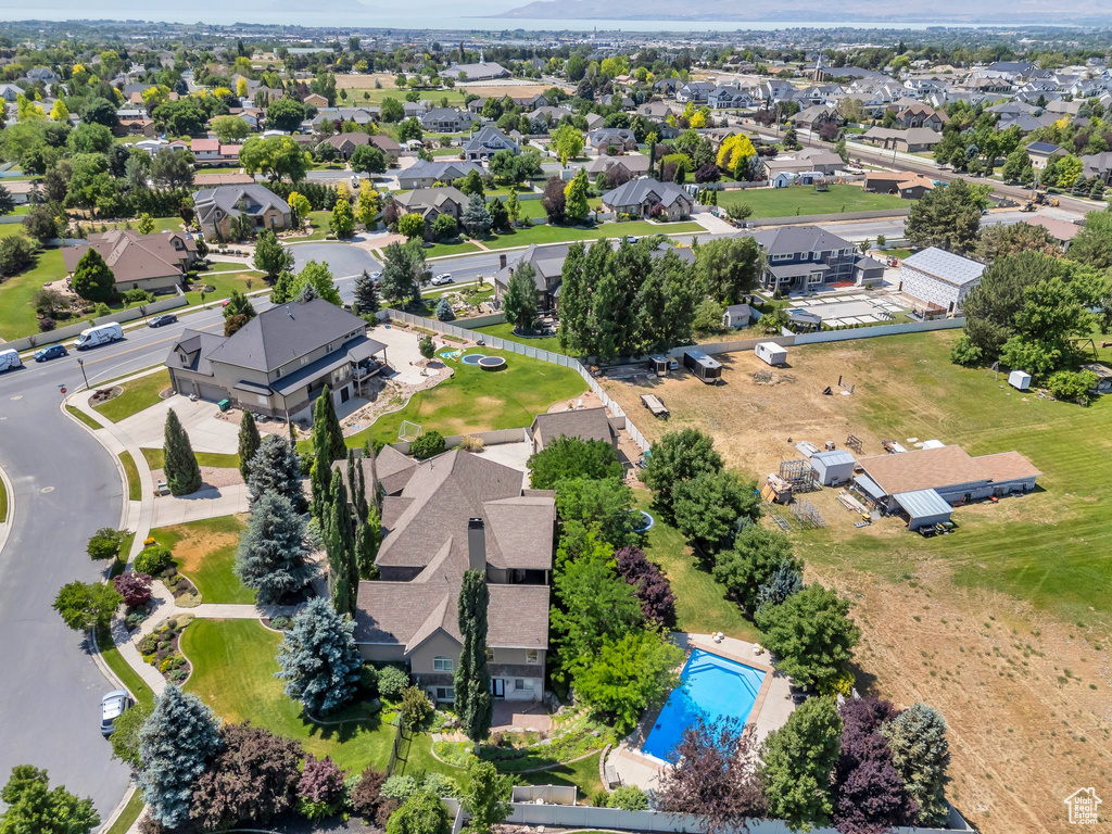 Aerial perspective of suburban area featuring a pool area