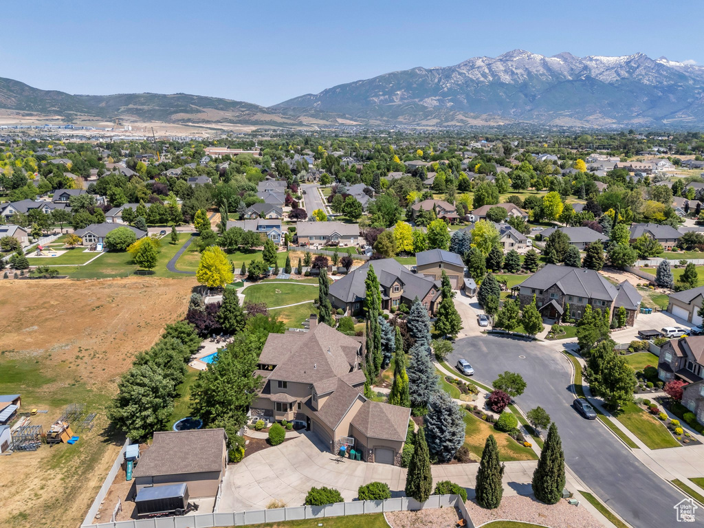 Aerial perspective of suburban area with a mountain backdrop