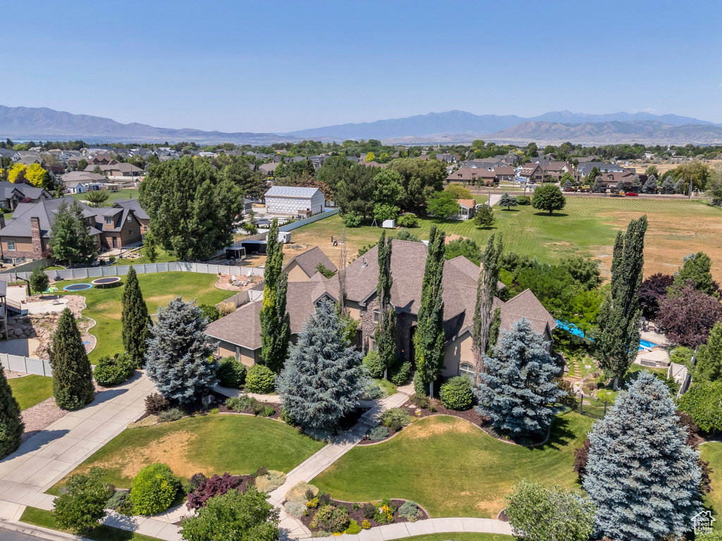 Aerial perspective of suburban area with a mountain backdrop