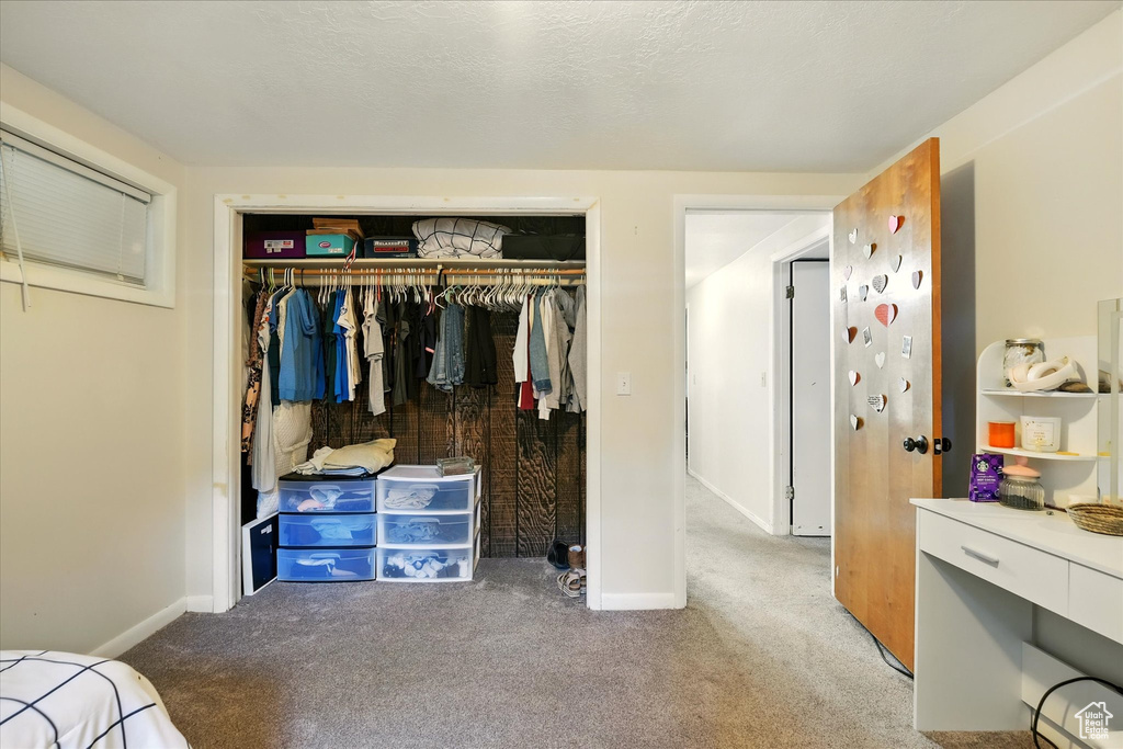 Bedroom with carpet floors and a closet