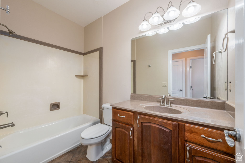 Full bathroom featuring vanity, shower / bath combination, and tile patterned flooring