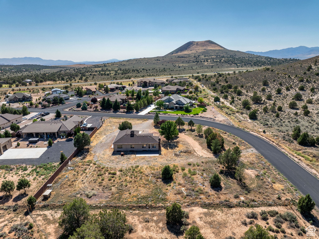 Aerial view of residential area featuring mountains