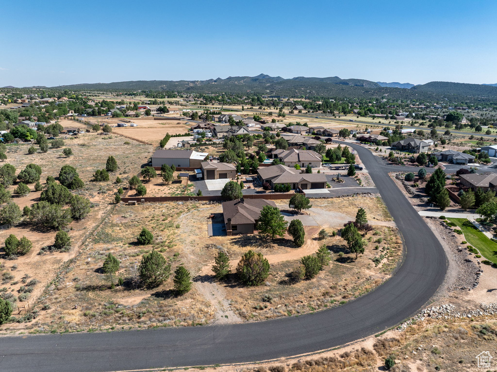 Aerial view of residential area featuring mountains
