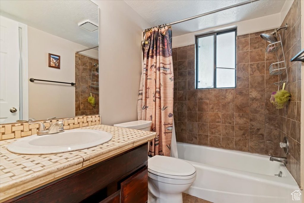 Full bath with vanity and shower / bathtub combination with curtain