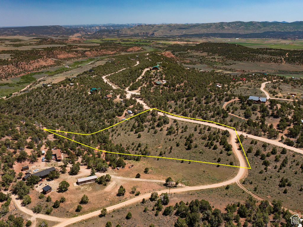 View of rural area with a mountain backdrop and property parcel outlined