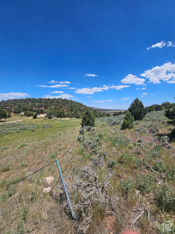 View of mountain background featuring rural landscape
