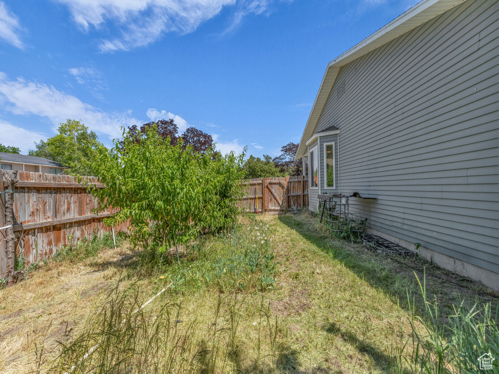 View of yard with a gate