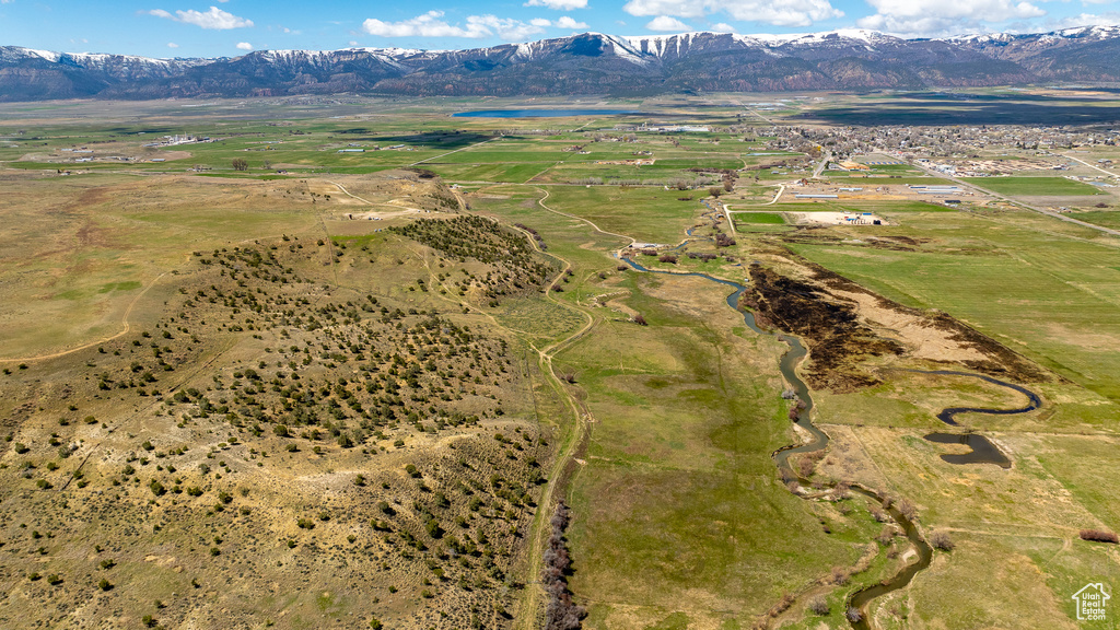 View of property location featuring a water and mountain view and rural landscape