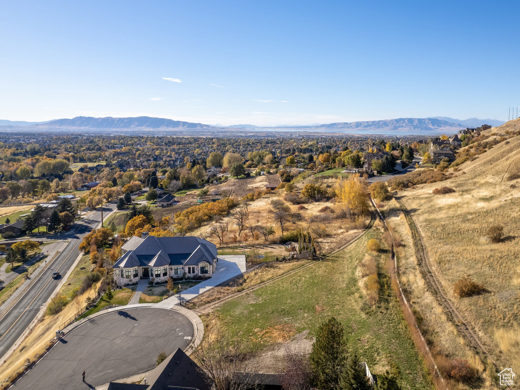 View of subject property featuring a mountainous background