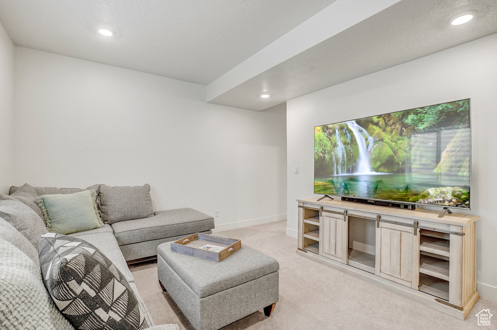 Living room featuring light carpet and recessed lighting