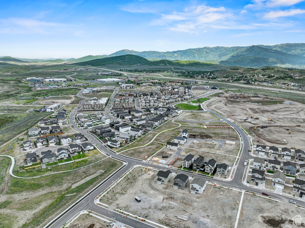 Aerial overview of property's location with property boundaries highlighted and nearby suburban area