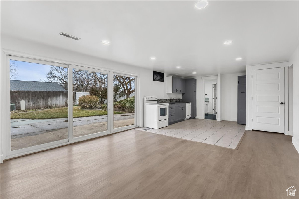 Unfurnished living room featuring recessed lighting and light wood finished floors