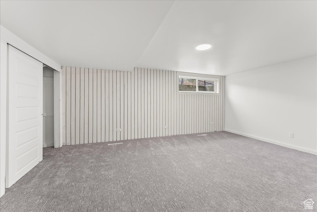 Unfurnished bedroom with carpet and a closet