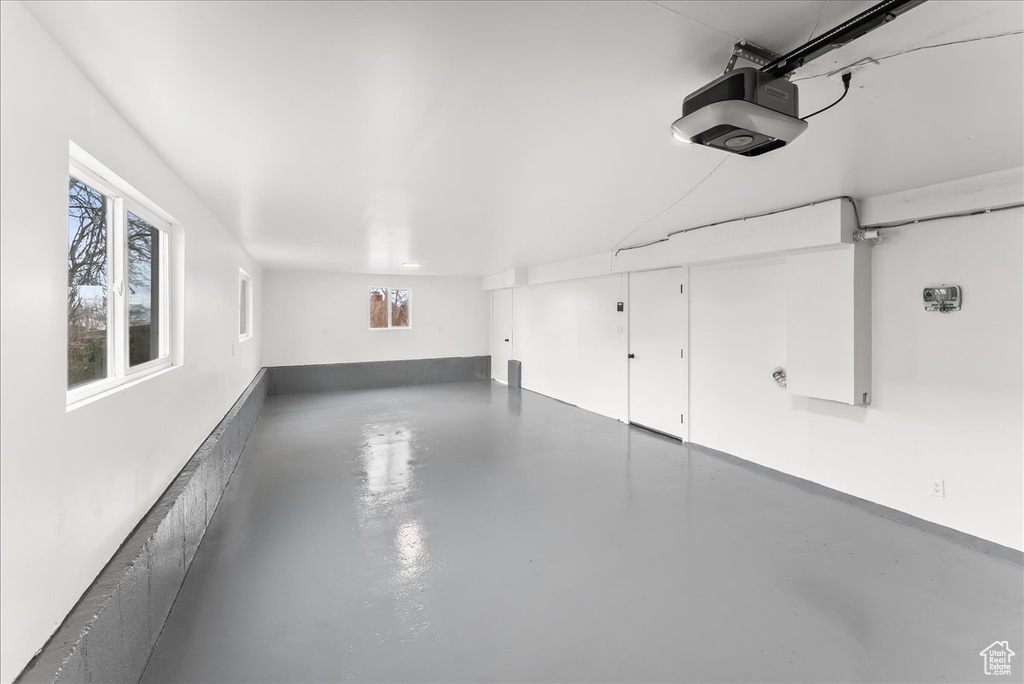 Garage featuring a garage door opener