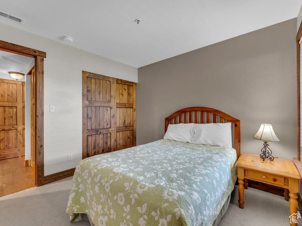 Bedroom with carpet flooring and baseboards