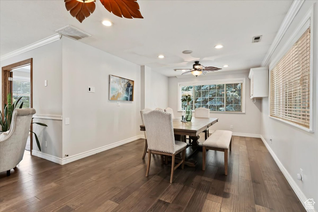 Dining space featuring a ceiling fan, recessed lighting, dark wood finished floors, and ornamental molding