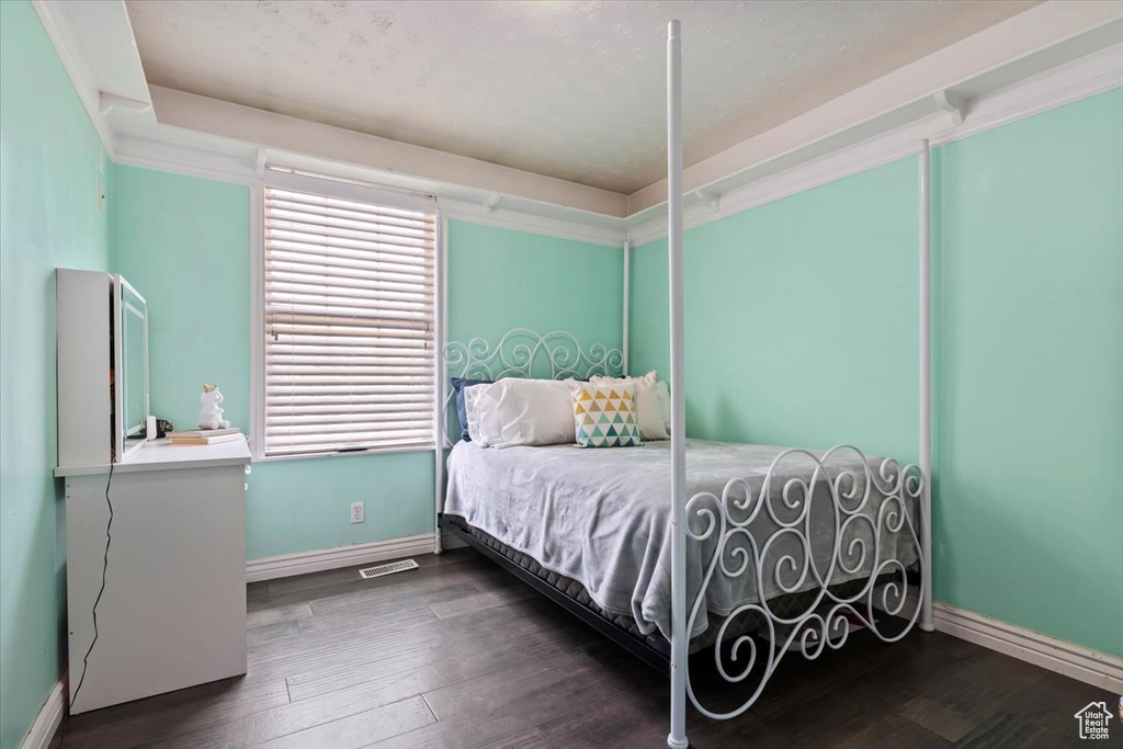 Bedroom with wood finished floors