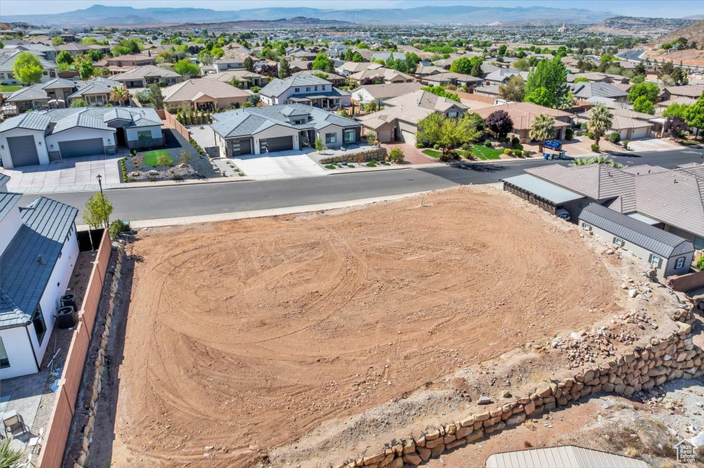 Aerial perspective of suburban area with a mountain backdrop