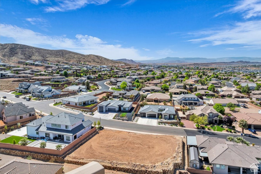 Aerial perspective of suburban area featuring a mountain backdrop