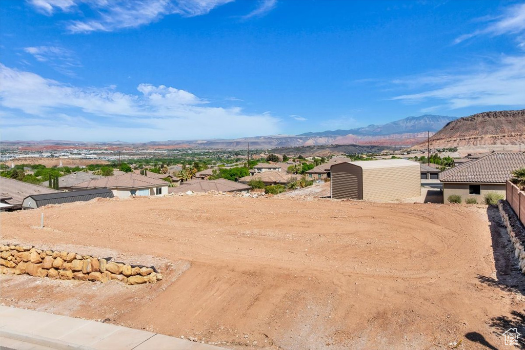 View of mountain background featuring nearby suburban area