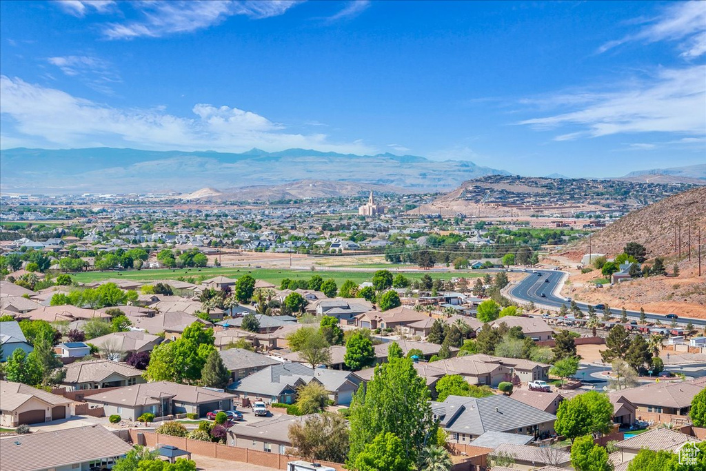 Aerial perspective of suburban area with a mountainous background
