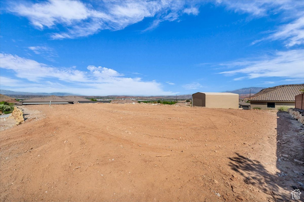 View of yard featuring an outdoor structure and a mountain view