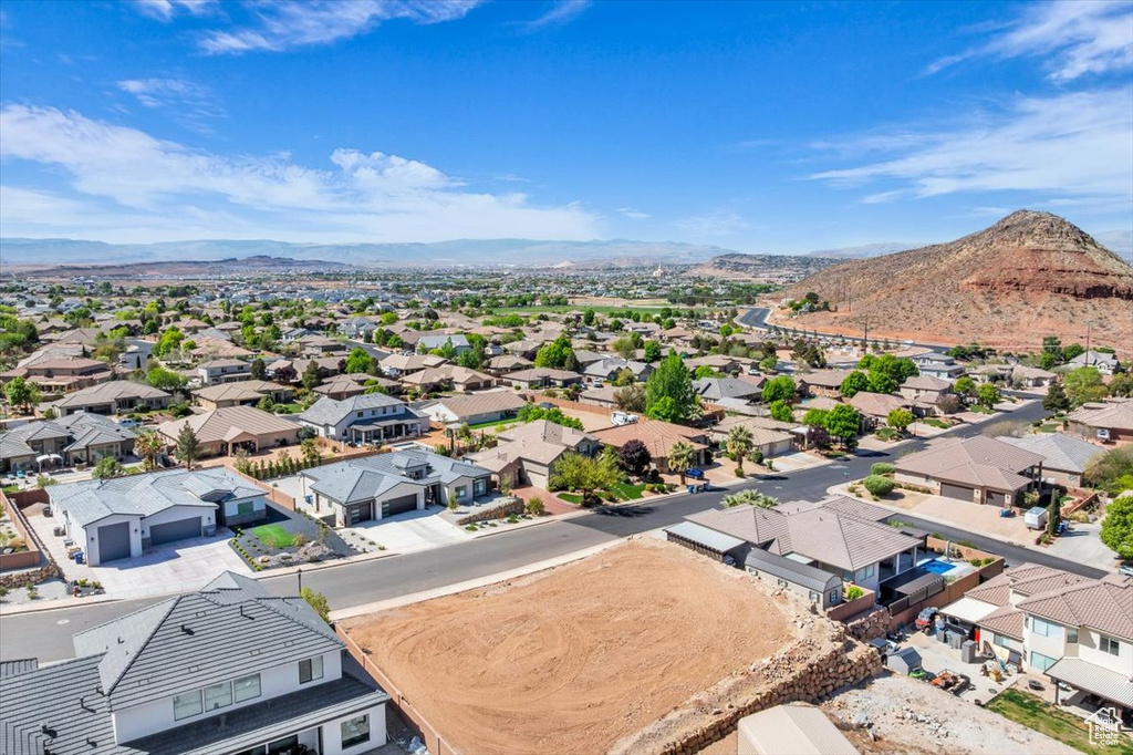 Aerial view of residential area featuring a mountainous background